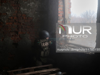 One of the new soldiers of the 57th Otaman Kost Hordiienko Motorized Brigade practices assault skills in the Kharkiv region, Ukraine, on Nov...