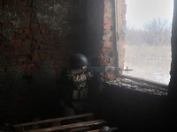 One of the new soldiers of the 57th Otaman Kost Hordiienko Motorized Brigade practices assault skills in the Kharkiv region, Ukraine, on Nov...