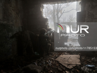 One of the new soldiers of the 57th Otaman Kost Hordiienko Motorized Brigade practices assault skills in the Kharkiv region, Ukraine, on Nov...