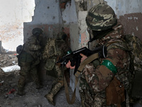 New soldiers of the 57th Otaman Kost Hordiienko Motorized Brigade practice assault skills in the Kharkiv region, Ukraine, on November 14, 20...