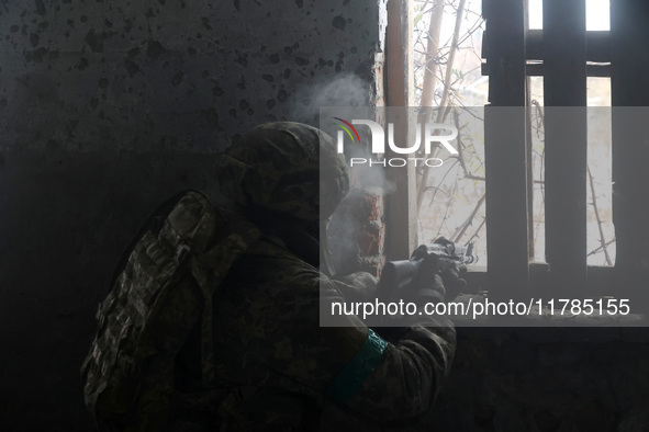 One of the new soldiers of the 57th Otaman Kost Hordiienko Motorized Brigade practices assault skills in the Kharkiv region, Ukraine, on Nov...