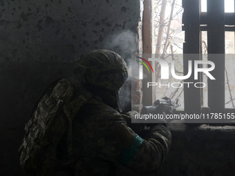 One of the new soldiers of the 57th Otaman Kost Hordiienko Motorized Brigade practices assault skills in the Kharkiv region, Ukraine, on Nov...