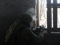 One of the new soldiers of the 57th Otaman Kost Hordiienko Motorized Brigade practices assault skills in the Kharkiv region, Ukraine, on Nov...