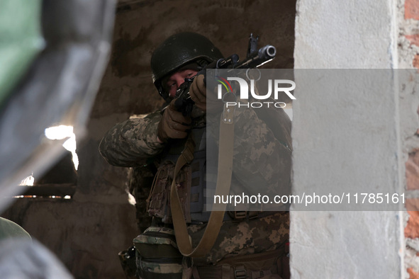 One of the new soldiers of the 57th Otaman Kost Hordiienko Motorized Brigade practices assault skills in the Kharkiv region, Ukraine, on Nov...