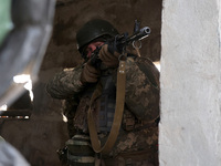 One of the new soldiers of the 57th Otaman Kost Hordiienko Motorized Brigade practices assault skills in the Kharkiv region, Ukraine, on Nov...