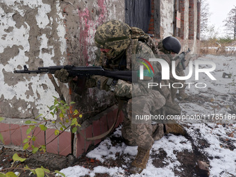 New soldiers of the 57th Otaman Kost Hordiienko Motorized Brigade practice assault skills in the Kharkiv region, Ukraine, on November 14, 20...