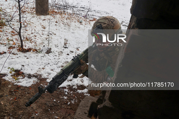 One of the new soldiers of the 57th Otaman Kost Hordiienko Motorized Brigade practices assault skills in the Kharkiv region, Ukraine, on Nov...