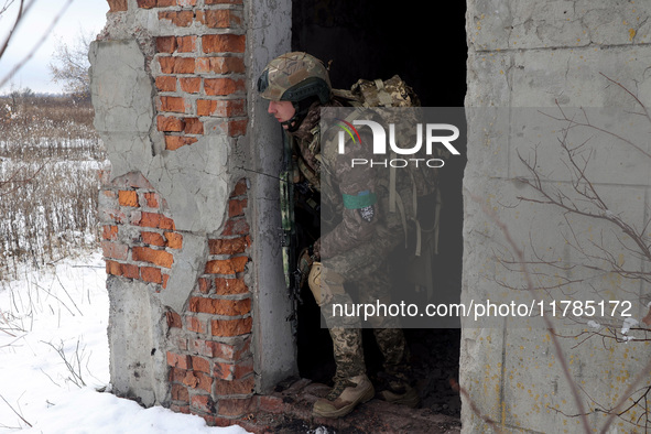 One of the new soldiers of the 57th Otaman Kost Hordiienko Motorized Brigade practices assault skills in the Kharkiv region, Ukraine, on Nov...