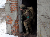 One of the new soldiers of the 57th Otaman Kost Hordiienko Motorized Brigade practices assault skills in the Kharkiv region, Ukraine, on Nov...