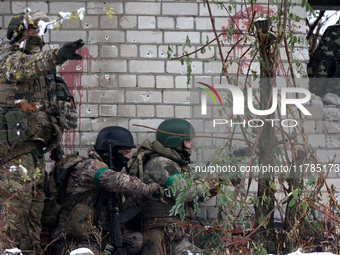 New soldiers of the 57th Otaman Kost Hordiienko Motorized Brigade practice assault skills in the Kharkiv region, Ukraine, on November 14, 20...