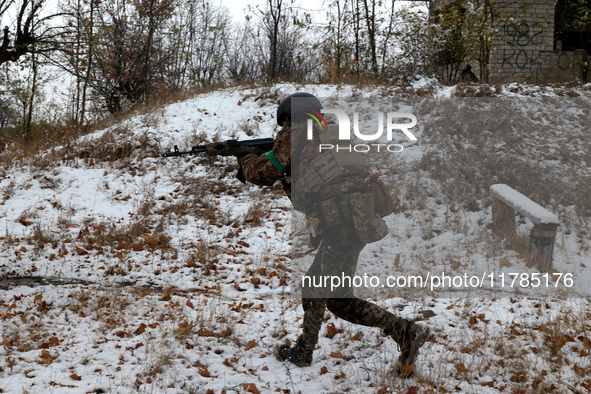 One of the new soldiers of the 57th Otaman Kost Hordiienko Motorized Brigade practices assault skills in the Kharkiv region, Ukraine, on Nov...