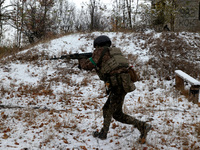 One of the new soldiers of the 57th Otaman Kost Hordiienko Motorized Brigade practices assault skills in the Kharkiv region, Ukraine, on Nov...