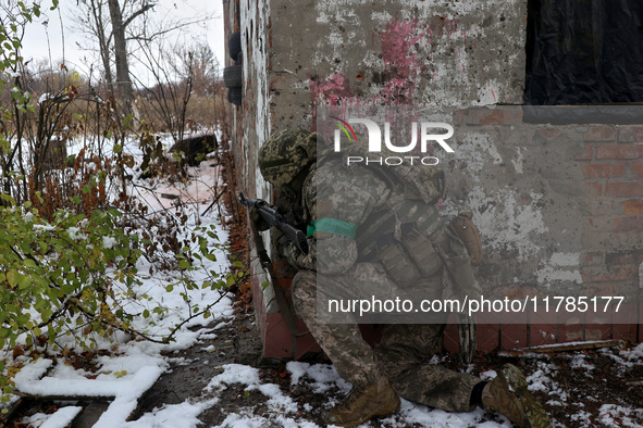 One of the new soldiers of the 57th Otaman Kost Hordiienko Motorized Brigade practices assault skills in the Kharkiv region, Ukraine, on Nov...