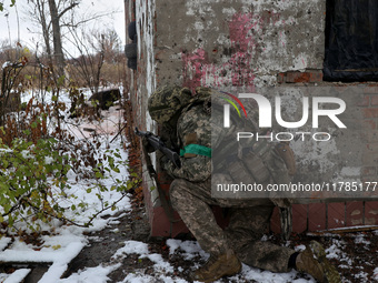 One of the new soldiers of the 57th Otaman Kost Hordiienko Motorized Brigade practices assault skills in the Kharkiv region, Ukraine, on Nov...