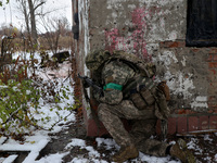 One of the new soldiers of the 57th Otaman Kost Hordiienko Motorized Brigade practices assault skills in the Kharkiv region, Ukraine, on Nov...