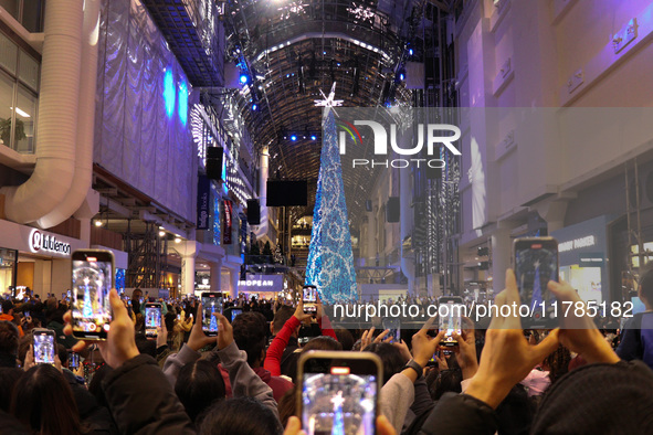 A large crowd gathers to witness the annual Christmas tree lighting ceremony at CF Toronto Eaton Centre in Ontario, Canada, on November 13,...