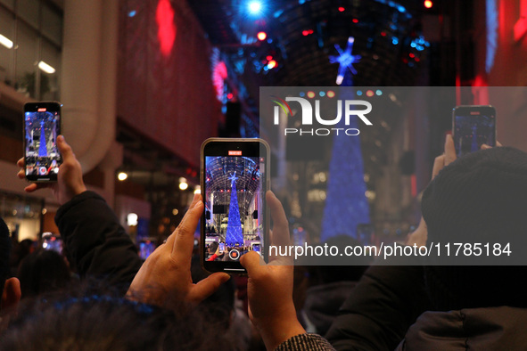 A large crowd gathers to witness the annual Christmas tree lighting ceremony at CF Toronto Eaton Centre in Ontario, Canada, on November 13,...