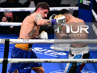 Jonathan Kogasso and Roberto Lizzi fight during the match for the Italian light heavyweight title at TAF 7 at Allianz Cloud Milano in Milan,...