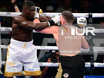 Jonathan Kogasso and Roberto Lizzi fight during the match for the Italian light heavyweight title at TAF 7 at Allianz Cloud Milano in Milan,...