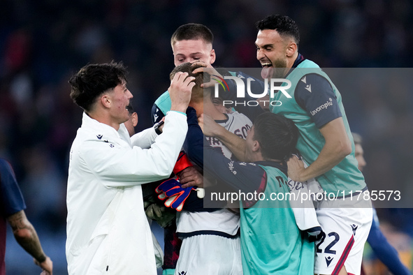 Jesper Karlsson of Bologna FC celebrated by his teammates at the end of the Serie A Enilive match between AS Roma and Bologna FC at Stadio O...