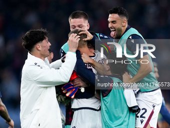 Jesper Karlsson of Bologna FC celebrated by his teammates at the end of the Serie A Enilive match between AS Roma and Bologna FC at Stadio O...