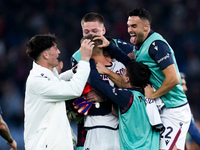 Jesper Karlsson of Bologna FC celebrated by his teammates at the end of the Serie A Enilive match between AS Roma and Bologna FC at Stadio O...