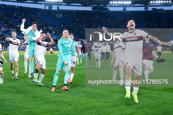 Riccardo Orsolini of Bologna FC and Lukasz Skorupski celebrate the victory at the end of the Serie A Enilive match between AS Roma and Bolog...