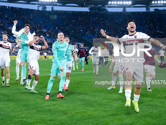 Riccardo Orsolini of Bologna FC and Lukasz Skorupski celebrate the victory at the end of the Serie A Enilive match between AS Roma and Bolog...