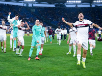 Riccardo Orsolini of Bologna FC and Lukasz Skorupski celebrate the victory at the end of the Serie A Enilive match between AS Roma and Bolog...