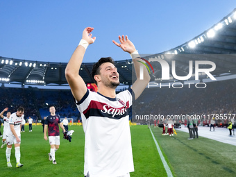 Riccardo Orsolini of Bologna FC celebrates the victory at the end of the Serie A Enilive match between AS Roma and Bologna FC at Stadio Olim...