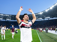 Riccardo Orsolini of Bologna FC celebrates the victory at the end of the Serie A Enilive match between AS Roma and Bologna FC at Stadio Olim...