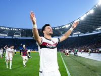 Riccardo Orsolini of Bologna FC celebrates the victory at the end of the Serie A Enilive match between AS Roma and Bologna FC at Stadio Olim...