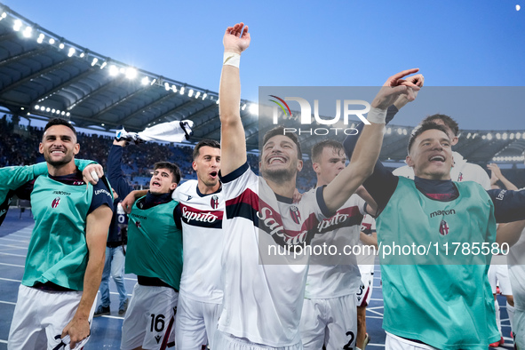 Riccardo Orsolini of Bologna FC celebrates  the victory with his teammates at the end of the Serie A Enilive match between AS Roma and Bolog...