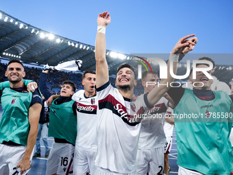 Riccardo Orsolini of Bologna FC celebrates  the victory with his teammates at the end of the Serie A Enilive match between AS Roma and Bolog...