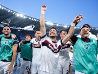 Riccardo Orsolini of Bologna FC celebrates  the victory with his teammates at the end of the Serie A Enilive match between AS Roma and Bolog...