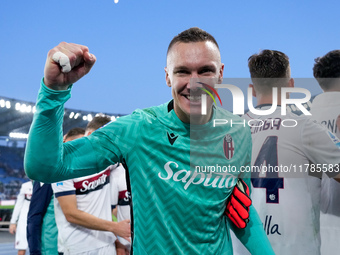 Lukasz Skorupski of Bologna FC celebrates the victory at the end of the Serie A Enilive match between AS Roma and Bologna FC at Stadio Olimp...