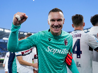 Lukasz Skorupski of Bologna FC celebrates the victory at the end of the Serie A Enilive match between AS Roma and Bologna FC at Stadio Olimp...