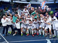 Players of Bologna FC celebrate the victory at the end of the Serie A Enilive match between AS Roma and Bologna FC at Stadio Olimpico on Nov...