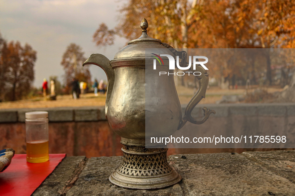 A Kashmiri traditional samovar is pictured inside a Mughal garden during an autumn day in Srinagar, Jammu and Kashmir, on November 17, 2024....