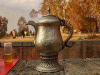 A Kashmiri traditional samovar is pictured inside a Mughal garden during an autumn day in Srinagar, Jammu and Kashmir, on November 17, 2024....