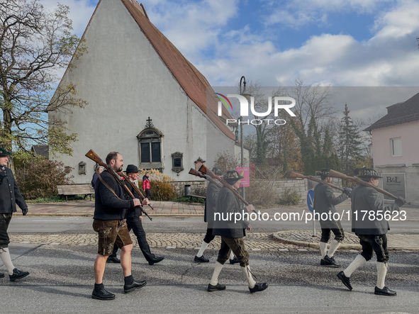 A Remembrance Day parade takes place in Gauting, Germany, on November 17, 2024. Members of local traditional associations, dressed in formal...