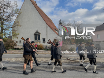 A Remembrance Day parade takes place in Gauting, Germany, on November 17, 2024. Members of local traditional associations, dressed in formal...