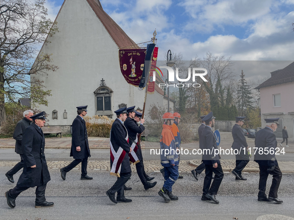 A Remembrance Day parade takes place in Gauting, Germany, on November 17, 2024. Members of local traditional associations, dressed in formal...