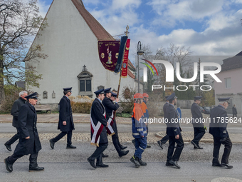 A Remembrance Day parade takes place in Gauting, Germany, on November 17, 2024. Members of local traditional associations, dressed in formal...