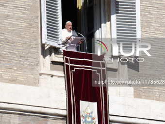 Pope Francis addresses the crowd from the window of the apostolic palace overlooking St. Peter's Square during the Angelus prayer in The Vat...