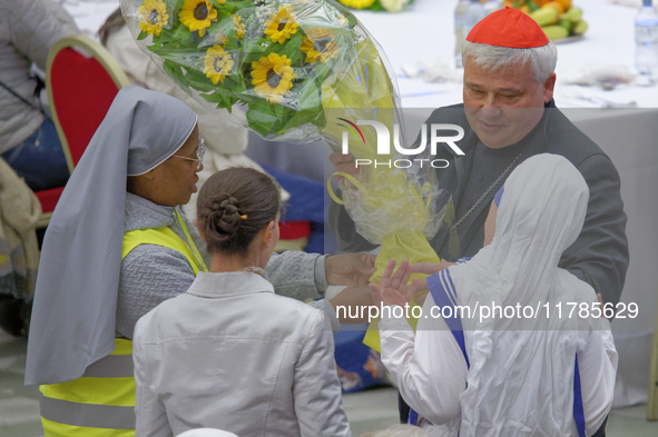 Cardinal Konrad Krajewski talks with a group of nuns before the lunch with the Pope and the poor on the occasion of the VII World Day of the...