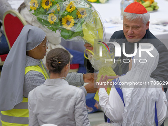 Cardinal Konrad Krajewski talks with a group of nuns before the lunch with the Pope and the poor on the occasion of the VII World Day of the...