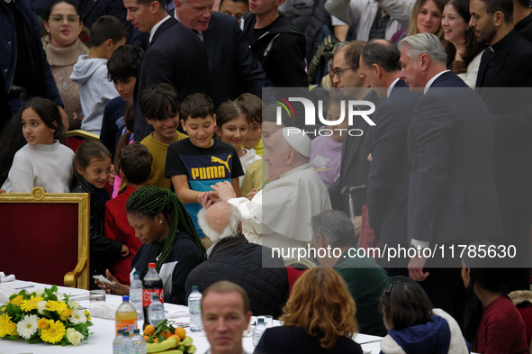 Pope Francis attends a lunch organized on the World Day of the Poor at the Paul VI audience hall in The Vatican, on November 17, 2024. 