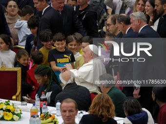 Pope Francis attends a lunch organized on the World Day of the Poor at the Paul VI audience hall in The Vatican, on November 17, 2024. (