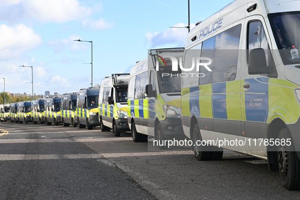 A row of police vehicles is outside Wembley prior to the UEFA Nations League 2024/5, League B, Group B2 match between England and the Republ...